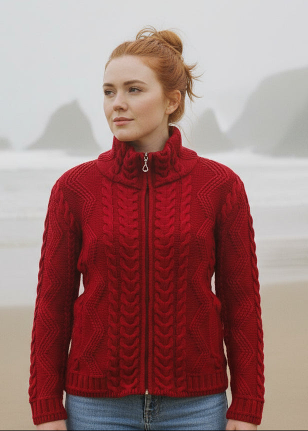 Woman wearing a red knitted jacket with a mountainous background