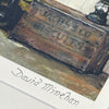 Close-up of a vintage-style product with 'Bacchus' branding, on a textured surface.