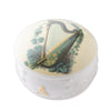 Round container with harp design on a white background