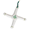 White ceramic cross with green accents and clover design on a white background