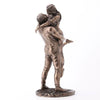 Bronze statue of a couple embracing on a white background
