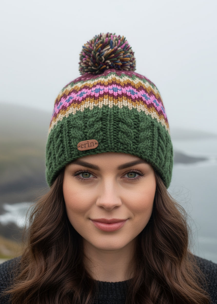 Knitted erin knitwear beanie with colorful pattern and pom-pom on a white background