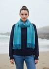 A blue and green check lambswool scarf with fringes, displayed on a plain background.