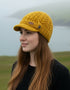 Erin Aran Cable Peak Hat | Sunflower