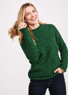 Woman wearing a green sweater against a white background