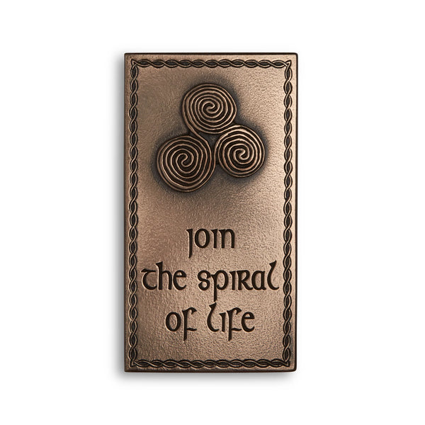 Bronze plaque with spiral design and 'join the spiral of life' text on a white background