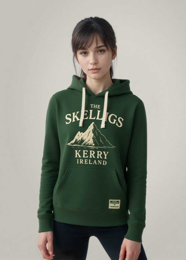 Person wearing a green hoodie with 'The Skelligs Kerry Ireland' design on a plain background
