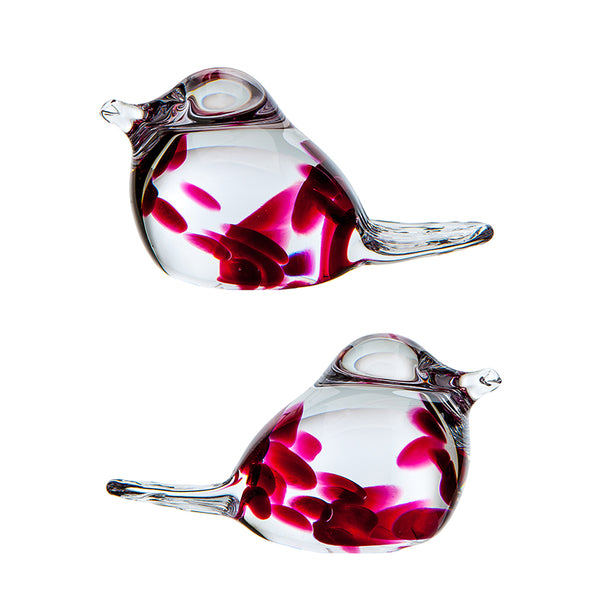 Two handcrafted glass birds with red and clear colors, likely made from glass blowing.