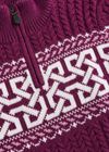 Close-up of a maroon knit sweater with white pattern