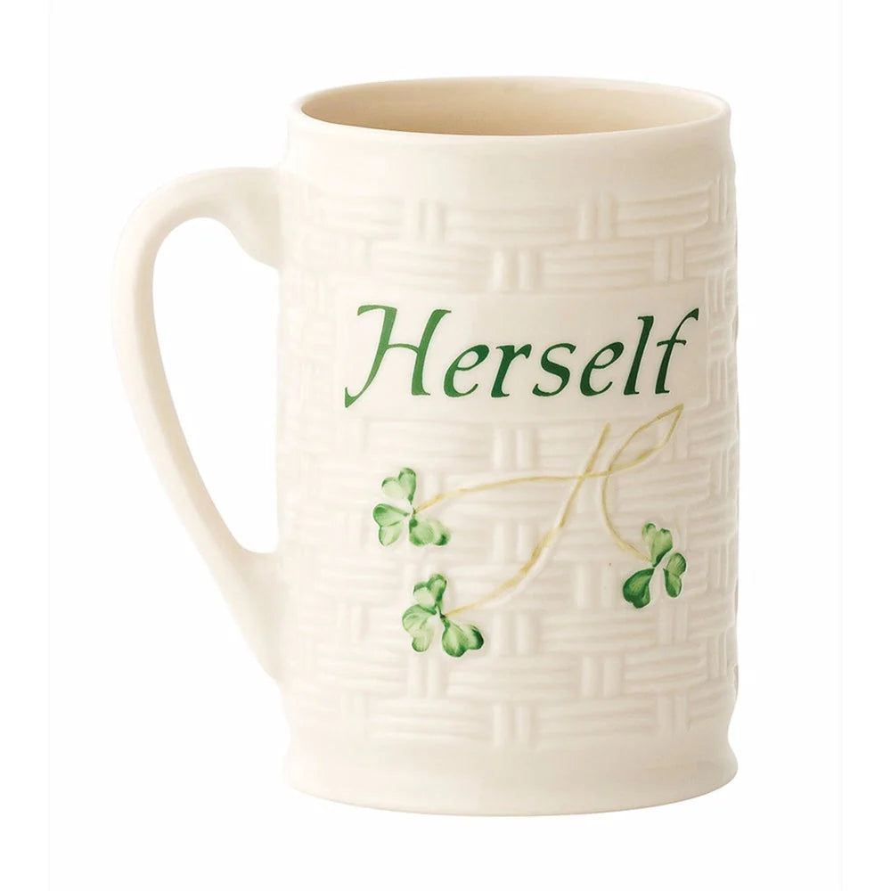 White mug with 'Herself' text and green leaf design on a white background