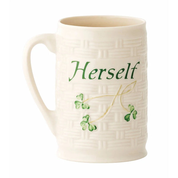 White mug with 'Herself' text and green leaf design on a white background