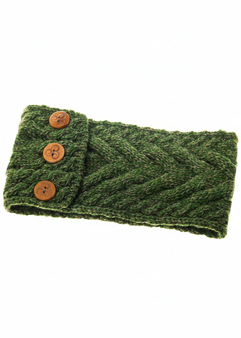 Green knitted headband with brown buttons on a white background