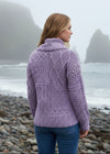 Woman wearing a purple aran knitted cardigan