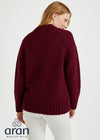 Woman wearing a burgundy sweater with 'Aran Woollen Mills' branding on a white background