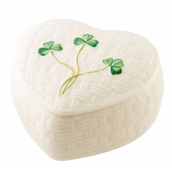 Heart-shaped trinket box with clover design on a white background
