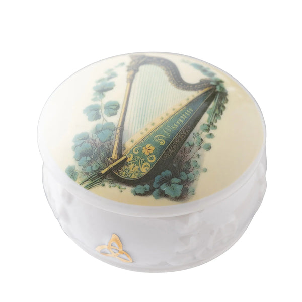 Round container with harp design on a white background