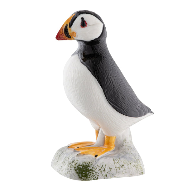 Statue of a puffin on a white background