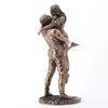 Bronze statue of a couple embracing on a white background