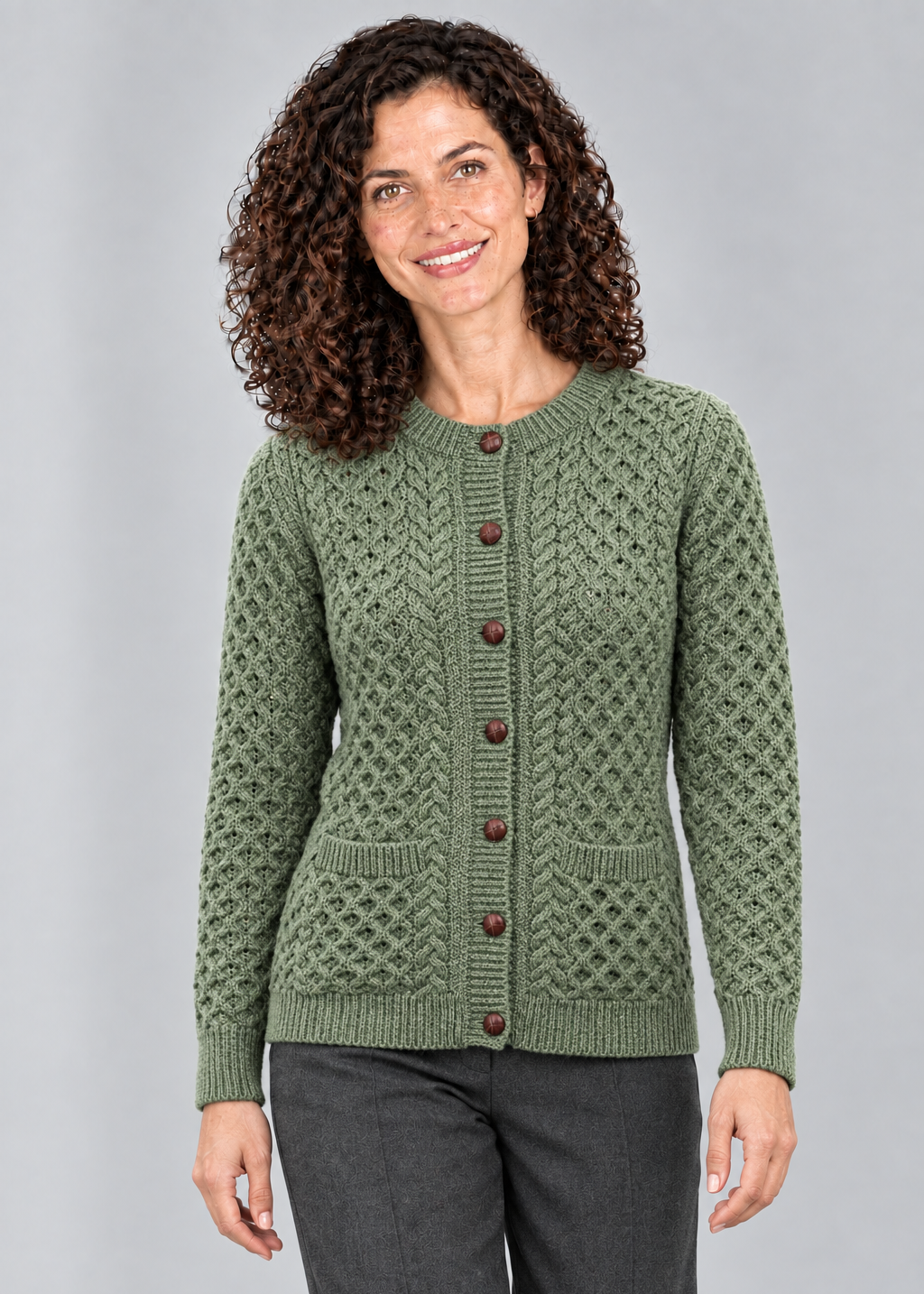 Green Leaf cardigan stepping studio pose