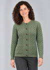 Green Leaf cardigan stepping studio pose
