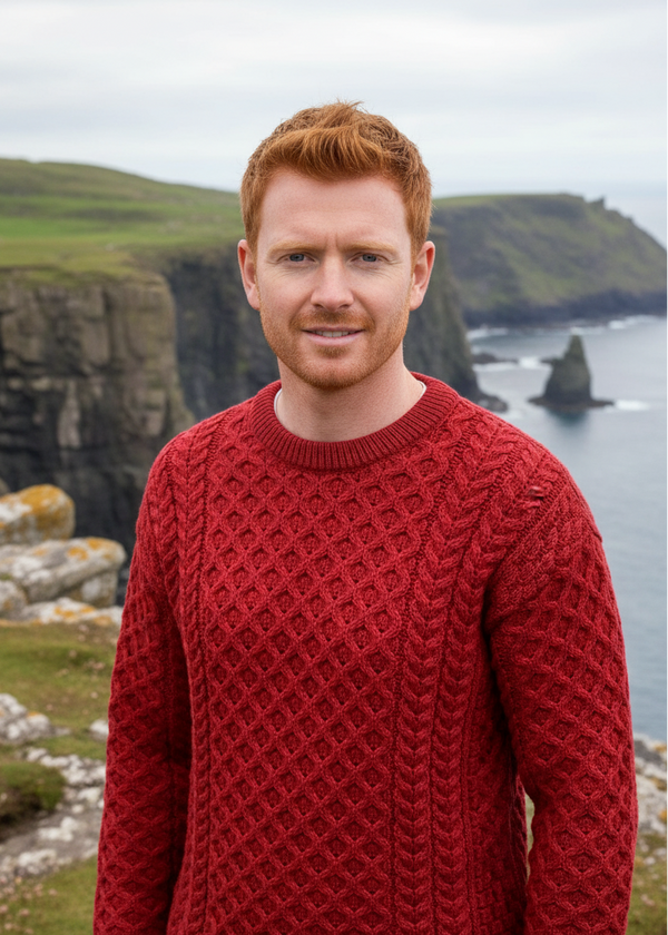 man wearing a redaran  knitted sweater with a patterned design outdoors.