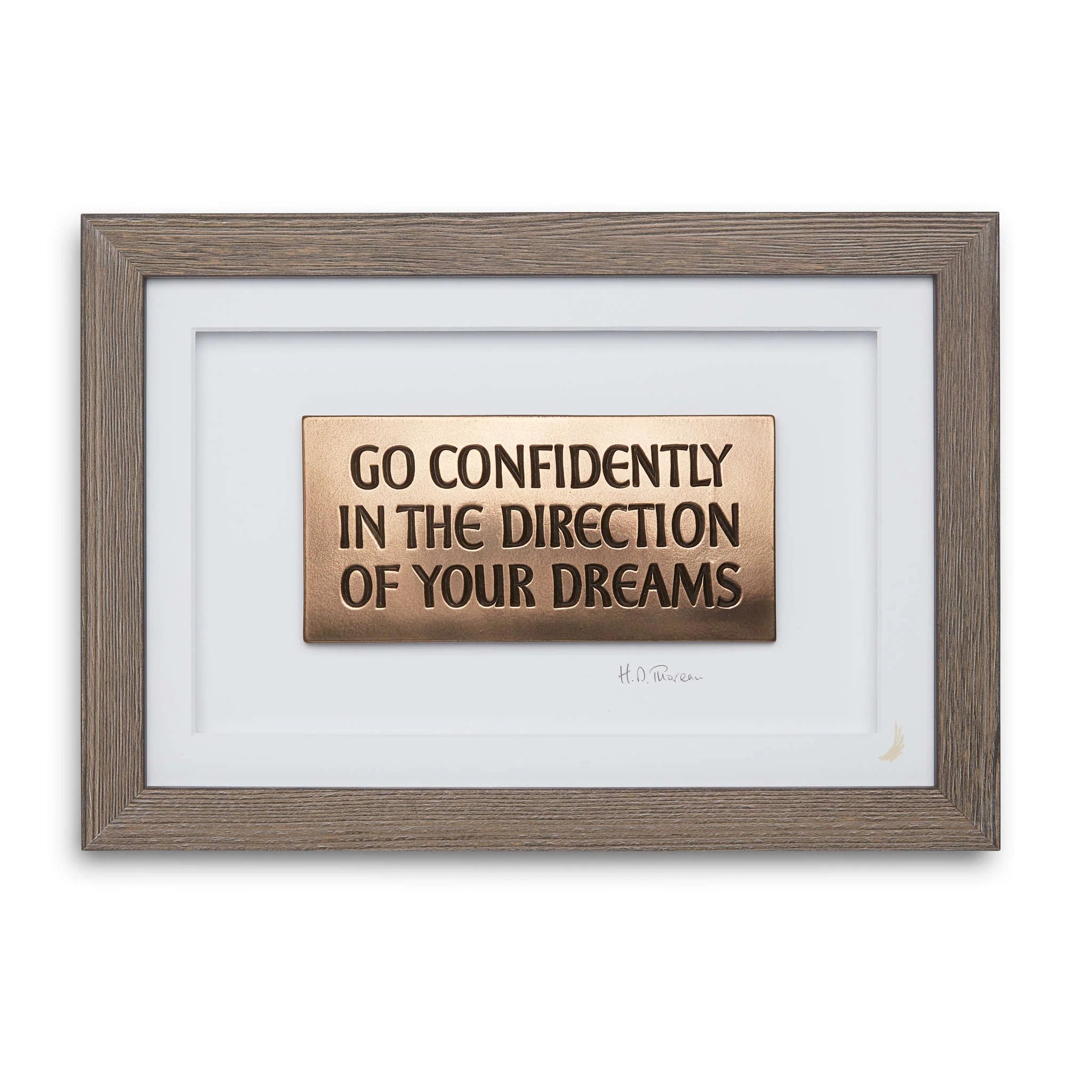 Framed motivational quote print with 'Go Confidently in the Direction of Your Dreams' on a white background