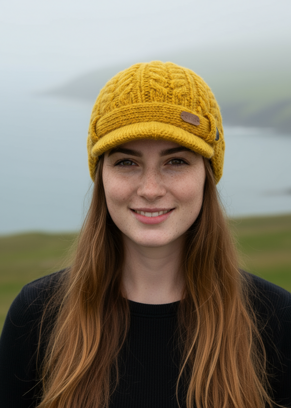 Erin Aran Cable Peak Hat | Sunflower