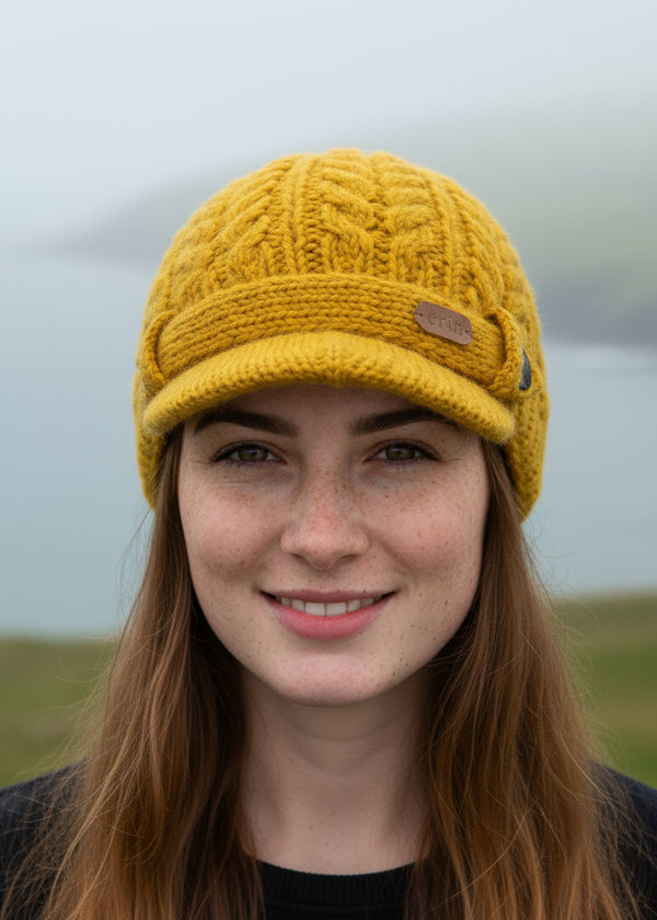 Erin Aran Cable Peak Hat | Sunflower