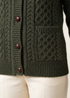 Army-green cardigan pocket and hem close-up