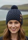 charcoal knit beanie with brown buttons on a white background