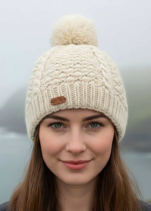 natural erin irish knitted beanie with pom-pom on a white background