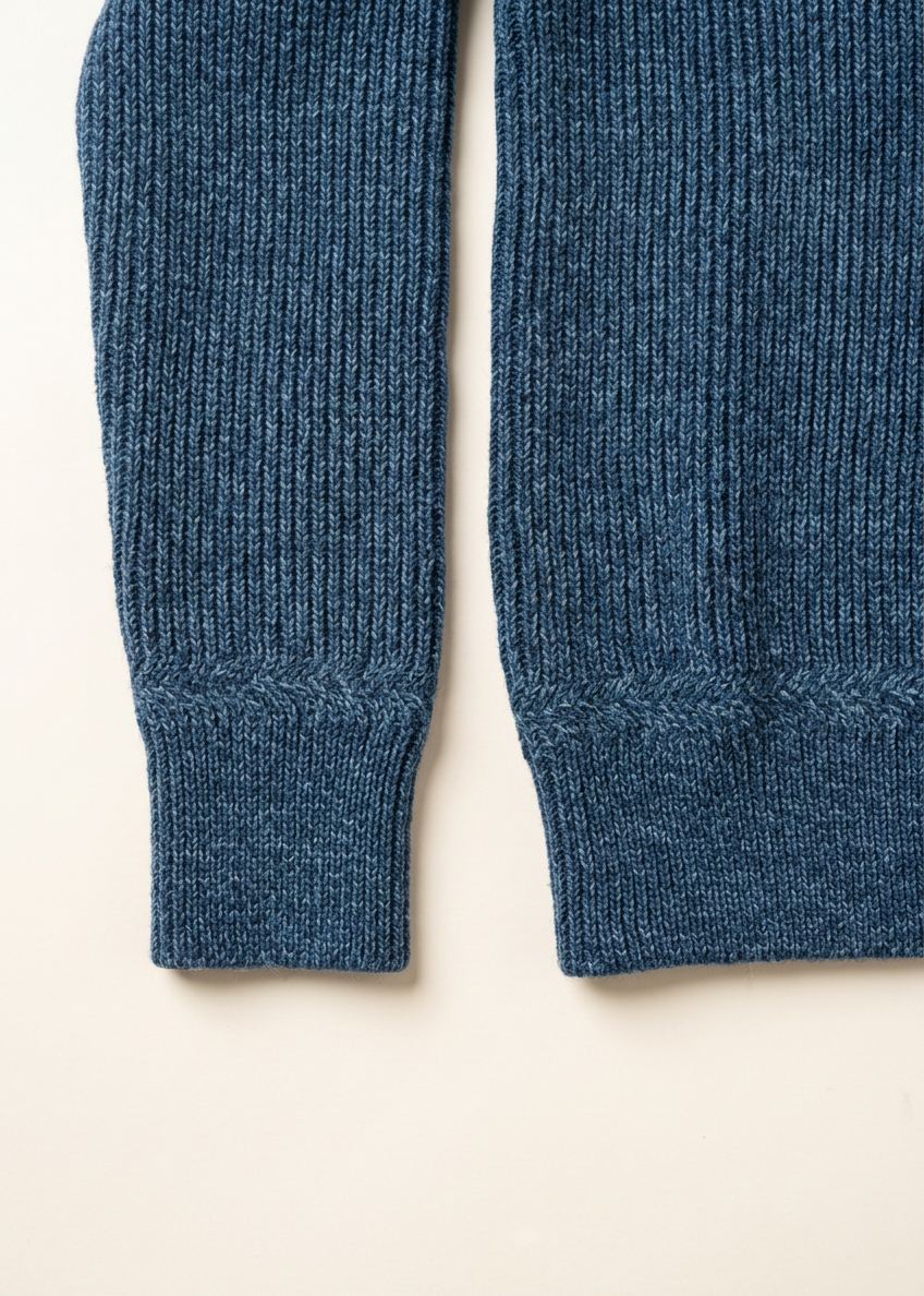 Blue sweater sleeve and hem detail