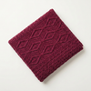 Burgundy blanket diagonal flat lay
