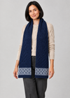 Celtic scarf over Aran knitwear, stepping pose