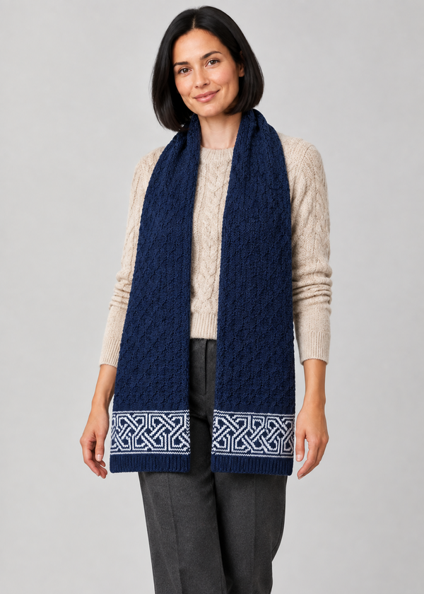 Celtic scarf over Aran knitwear, stepping pose