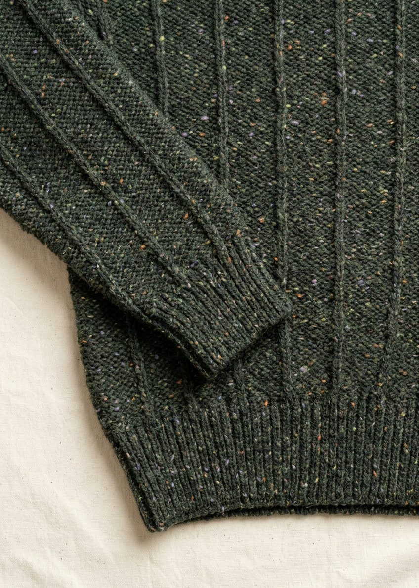 Cuff and hem close-up on off-white