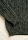 Cuff and hem close-up on off-white