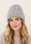 Female model wearing the grey hat on an off-white backdrop