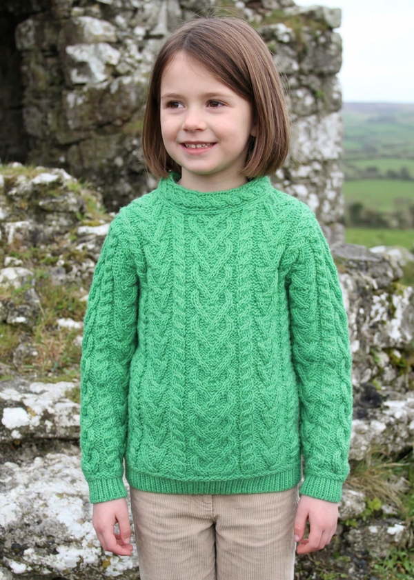Green Aran sweater on a new child model