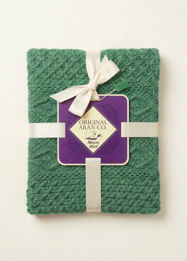 Green blanket with original ribbon and label