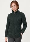 Green cardigan three-quarter studio pose