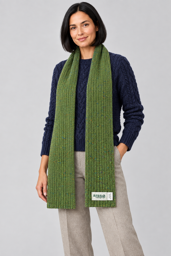 Green scarf over Aran knitwear, standing pose