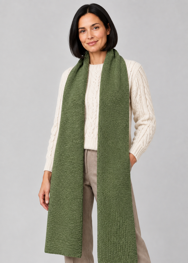 Green scarf over Aran knitwear, standing pose