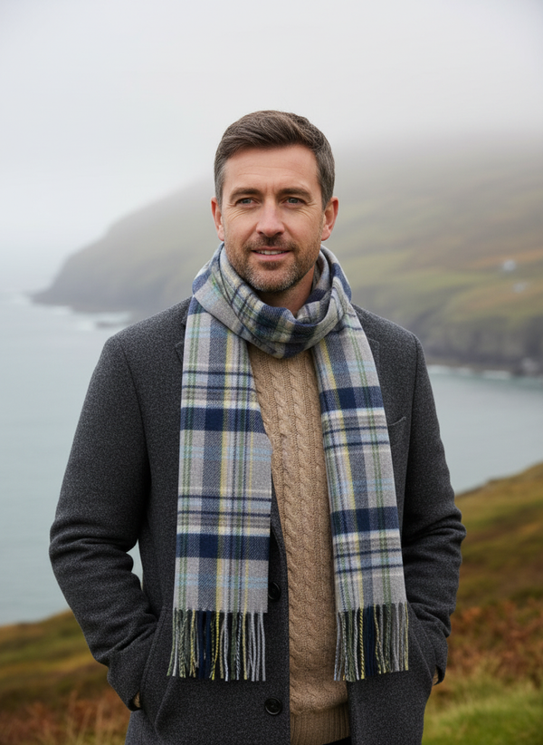 Male model wearing John Hanly grey blue check merino scarf in Irish autumn setting
