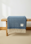 McNutt Sea Sky Blanket on rustic bench