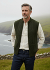 Male model in deep dark army green Aran vest