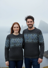 Man and woman wearing matching Aran jacquard sweaters