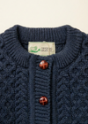 Navy cardigan label close-up with XS tab removed