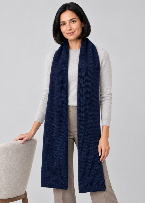 Navy scarf studio pose beside a chair
