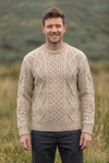 Oatmeal Aran sweater, lively front pose with the wine-red sweater’s model and grassland backdrop